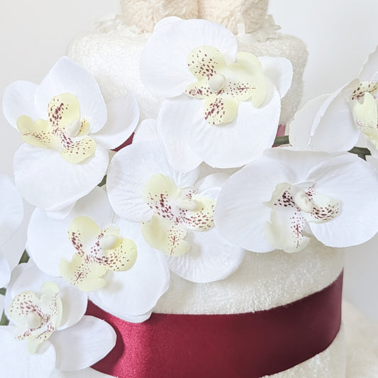 3-ų aukštų sauskelnių tortas su rankšluoščiais „Orchidėja“