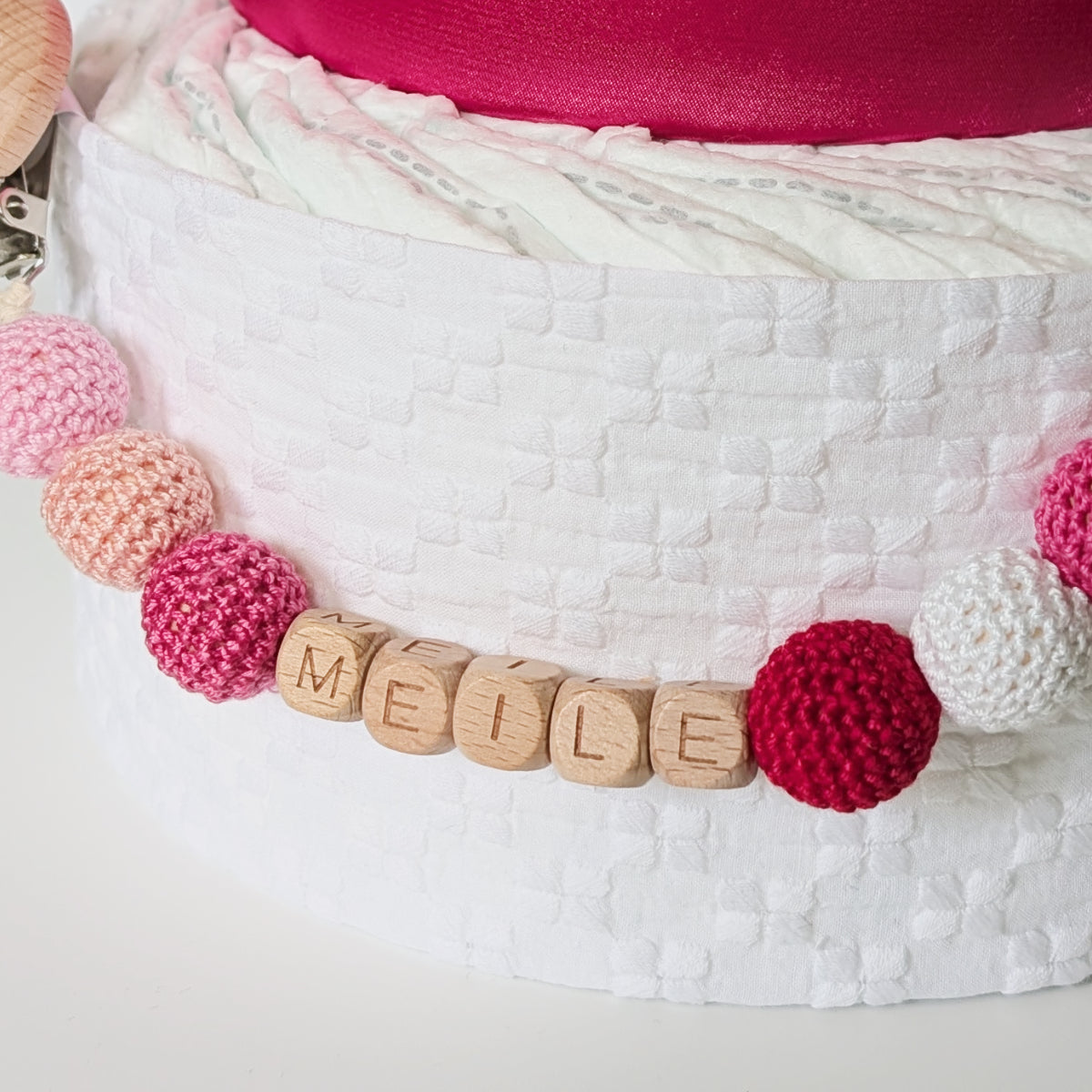 Sauskelnių tortas „Rožinė meilė“ su čiulptuko laikikliu